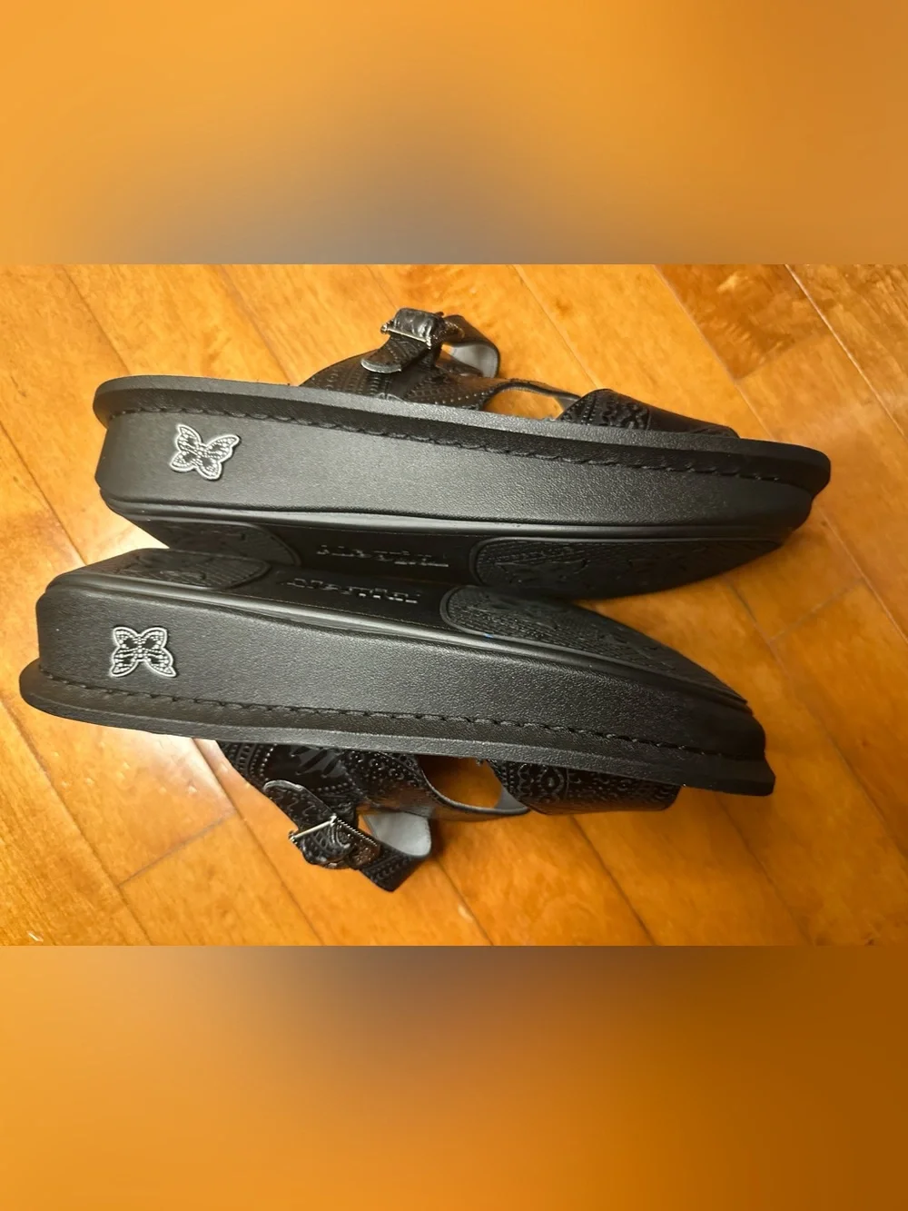 Alegria Black Embossed Leather Slide Sandals with Decorative Medallions